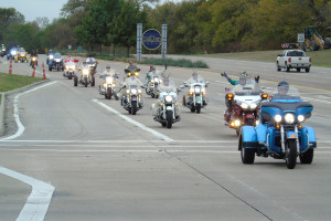 Participants of the MotorCops for Kids Motorcycle Toy Run ride along Hwy. 78 to Garland.