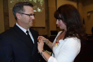 Hollie Wade pins her husband, Fire Chief Martin Wade, for  the ceremonial fire chief pinning May 2.