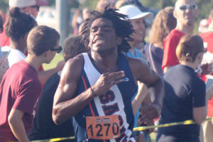 Sachse cross country runner AJ Tillman pours on the gas as he approaches the finish line during last Saturday’s inaugural Raider XC Invitational at Founders Park in Wylie. Tillman finished eighth in a time of 17:02.1, while the Mustang boys were also eighth in the team standings.