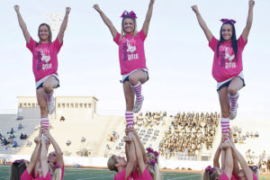 In support of Breast Cancer Awareness Month, Sachse High School cheerleaders celebrate Pink Out Friday by wearing pink attire and accessories during the game against Lakeview Centennial. Game attendees donned pink t-shirts in support of the event as well.